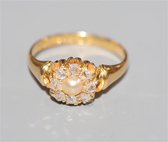 A late Victorian 18ct gold, rose cut diamond and split pearl set cluster ring, size O.